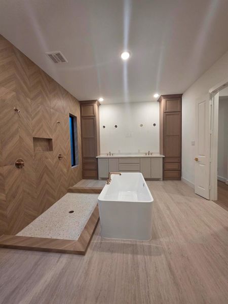 View of spa like primary bathroom upon entering. View of spa like primary bathroom upon entering.