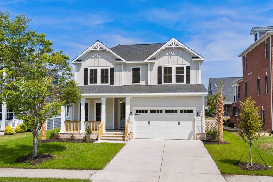 Front exterior of a new home in Creek Pointe, Moncks Corner, SC, highlighting curb appeal (Image 1). Front exterior of a new home in Creek Pointe, Moncks Corner, SC, highlighting curb appeal (Image 1).
