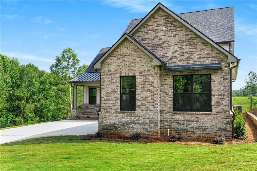 Front exterior of a new home in , Jefferson, GA, highlighting curb appeal (Image 29).