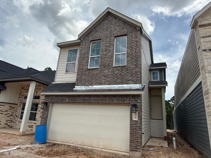 Front exterior of a new home in Kresston, Montgomery, TX, highlighting curb appeal (Image 2). Front exterior of a new home in Kresston, Montgomery, TX, highlighting curb appeal (Image 2).