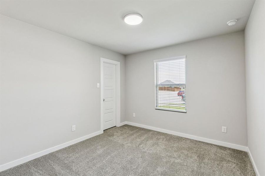 Bedroom in the Harper home plan by Trophy Signature Homes – REPRESENTATIVE PHOTO