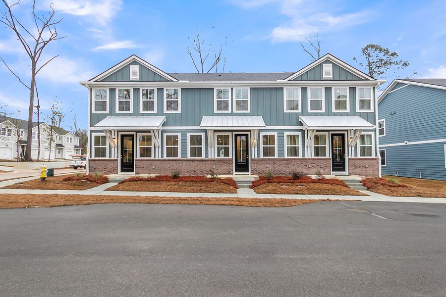 Front exterior of a new home in Windward Village, Summerville, SC, highlighting curb appeal (Image 29). Front exterior of a new home in Windward Village, Summerville, SC, highlighting curb appeal (Image 29).