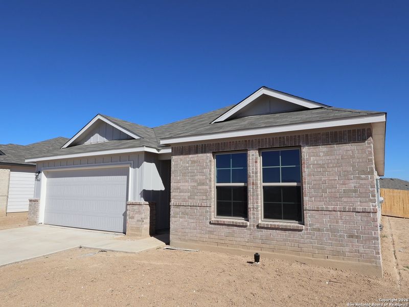 Front exterior of a new home in Greenspoint Heights, San Antonio, TX, highlighting curb appeal (Image 22).