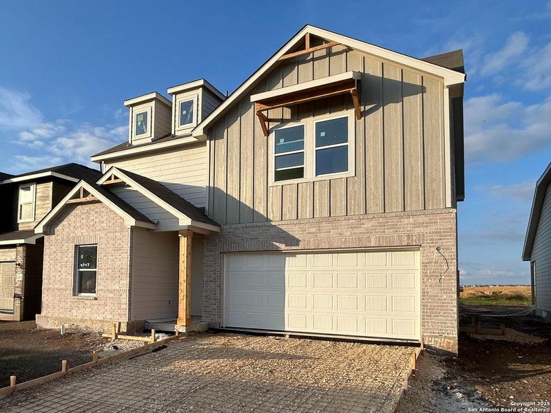Front exterior of a new home in Enclave at Hennersby Hollow 50's, San Antonio, TX, highlighting curb appeal (Image 1). Front exterior of a new home in Enclave at Hennersby Hollow 50's, San Antonio, TX, highlighting curb appeal (Image 1).