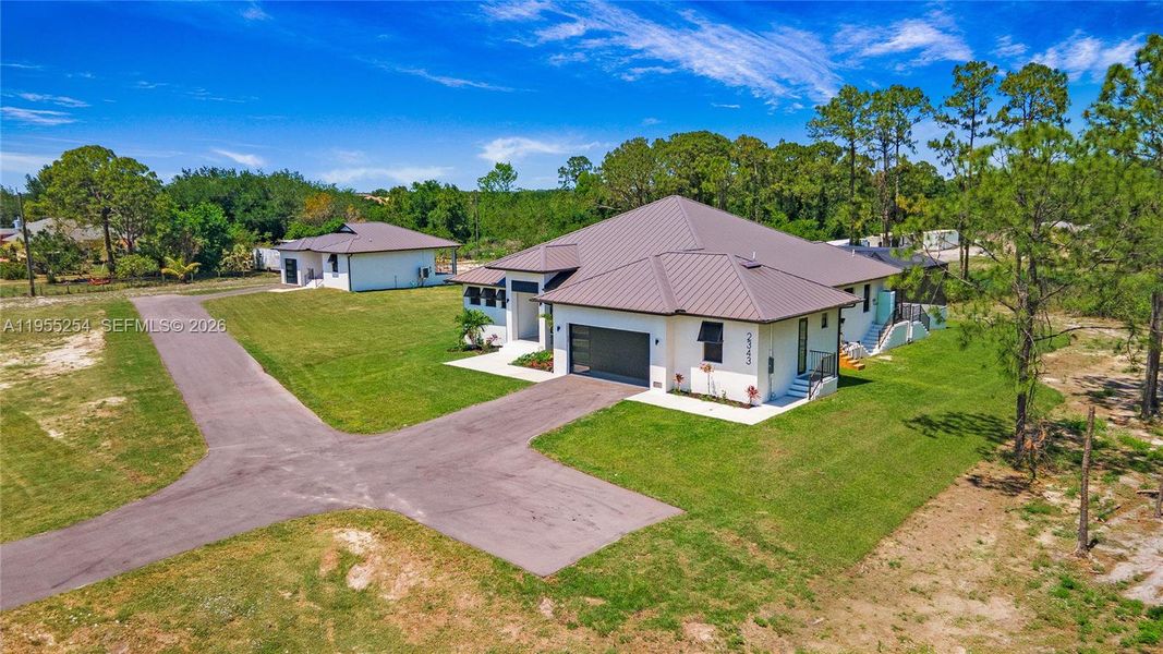 Front exterior of a new home in , Naples, FL, highlighting curb appeal (Image 29).