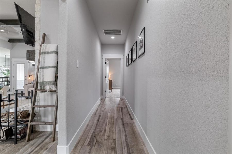 Hall with light hardwood / wood-style floors