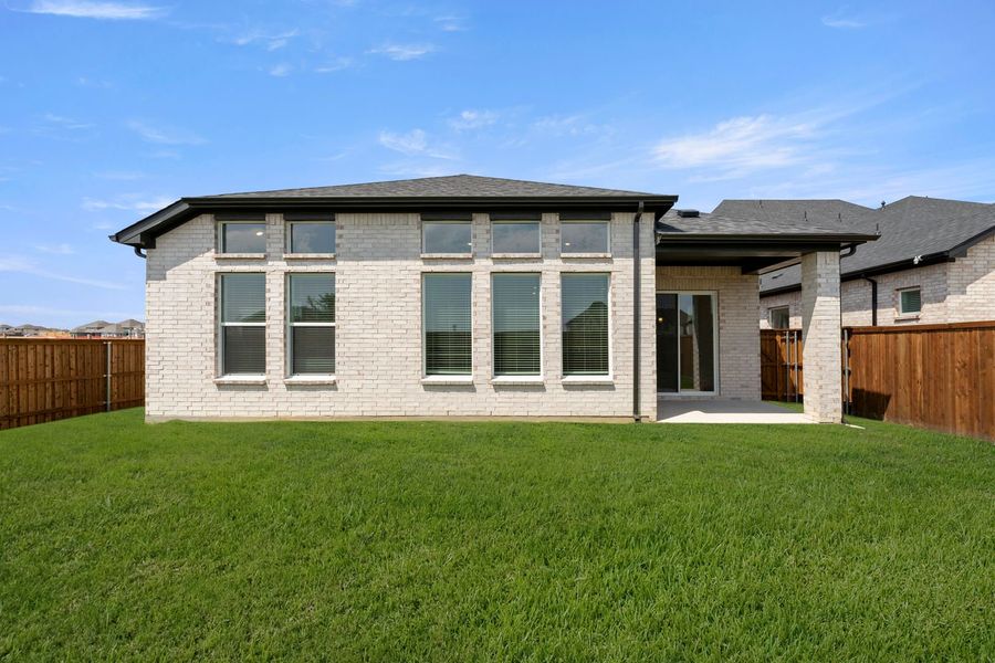 Exterior details and patio area of a home in Lily Creek at Sutton Fields, Aubrey (Image 3). Exterior details and patio area of a home in Lily Creek at Sutton Fields, Aubrey (Image 3).