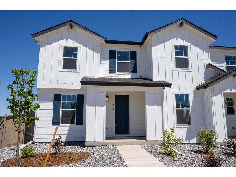 Front exterior of a new home in , Erie, CO, highlighting curb appeal (Image 1). Front exterior of a new home in , Erie, CO, highlighting curb appeal (Image 1).