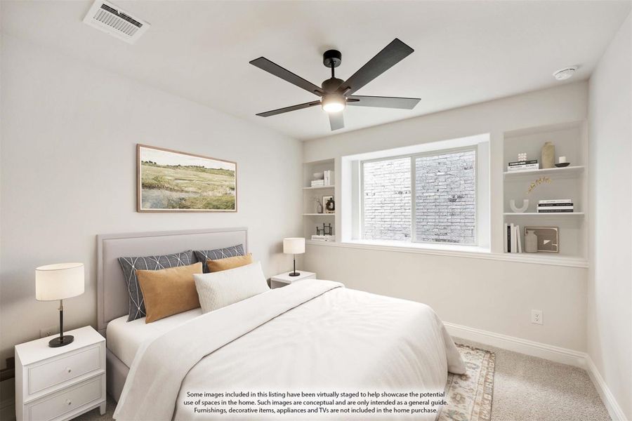 Bedroom with ceiling fan, built-in shelves flanking a window, and carpeted floor
