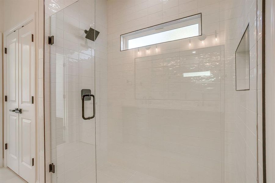 Full bathroom featuring a stall shower