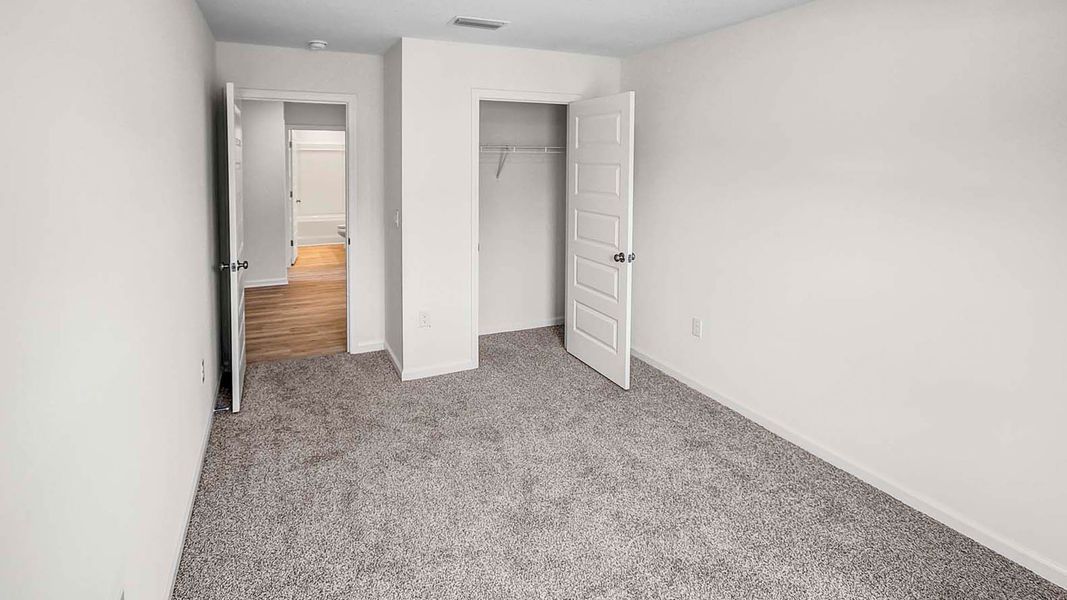 Representative unfurnished interior of a home built from the Lismore by D.R. Horton in Ashton Park Phase III, Freeport (Image 23).