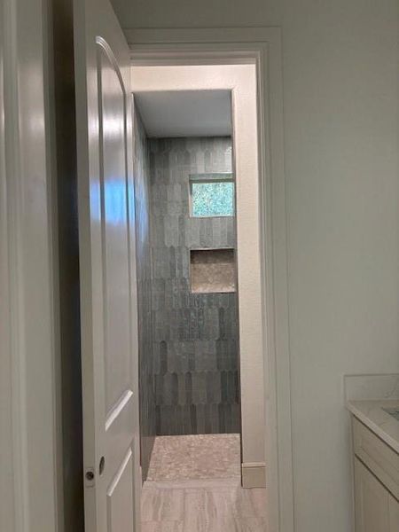 Full bath with walk in shower and vanity