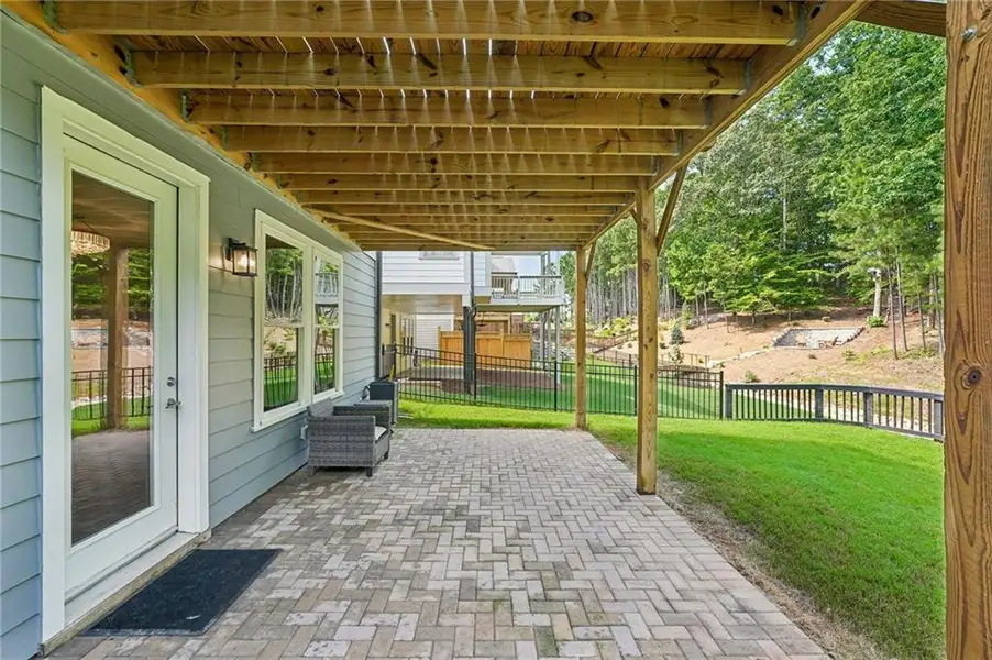 Exterior details and patio area of a home in Lakeside at River Green, Canton (Image 28).