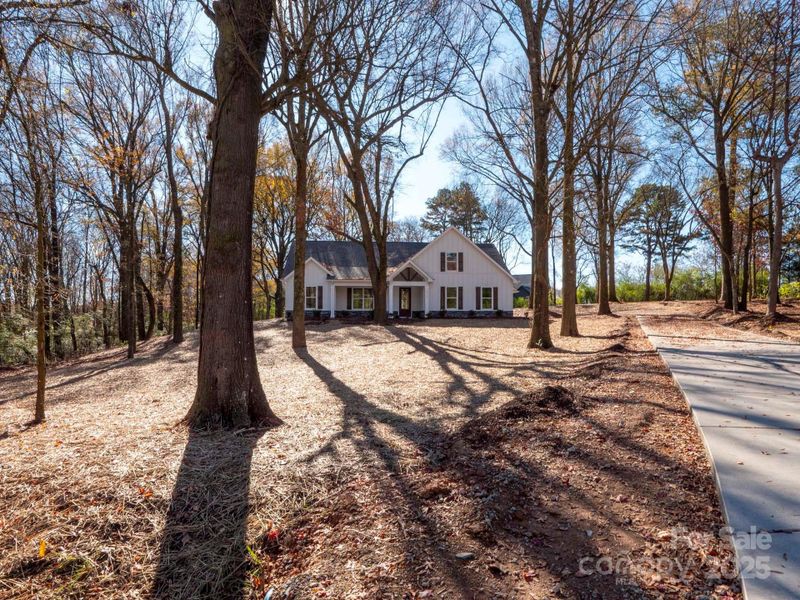 Front exterior of a new home in , Monroe, NC, highlighting curb appeal (Image 26). Front exterior of a new home in , Monroe, NC, highlighting curb appeal (Image 26).