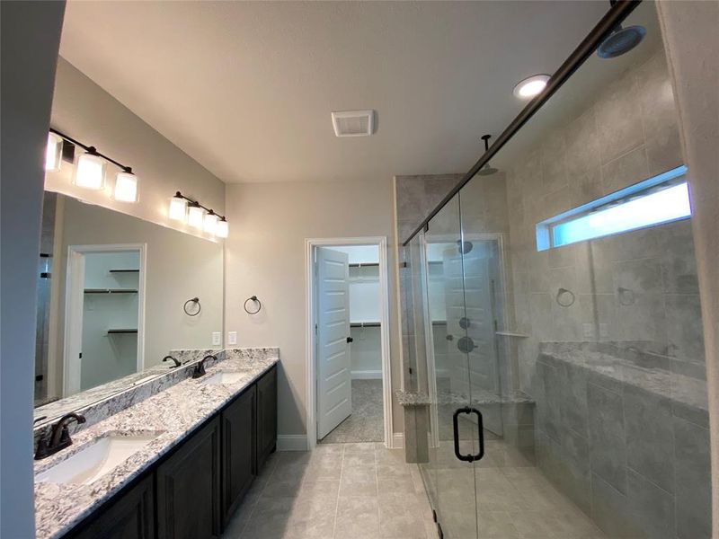 Master Bathroom featuring granite countertops and 12x24 oversized tile on floor & shower walls