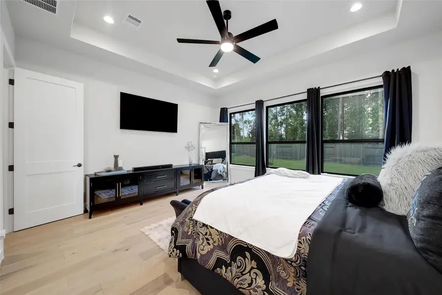 Furnished interior view inside a new home in ARTAVIA, Conroe (Image 14).