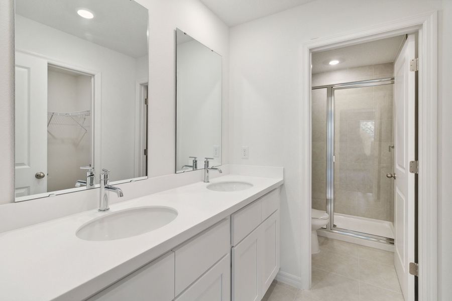 Dual Vanities & Enclosed Shower in Primary Bathroom