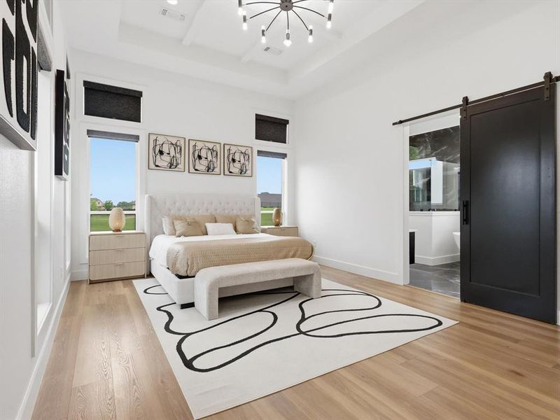 Spacious room featuring wood-finish flooring, a coffered ceiling, and a modern chandelier