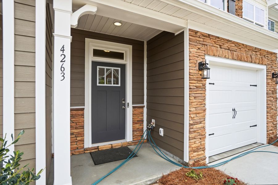 Exterior details and patio area of a home in Harrisburg Village Townhomes, Harrisburg (Image 3).