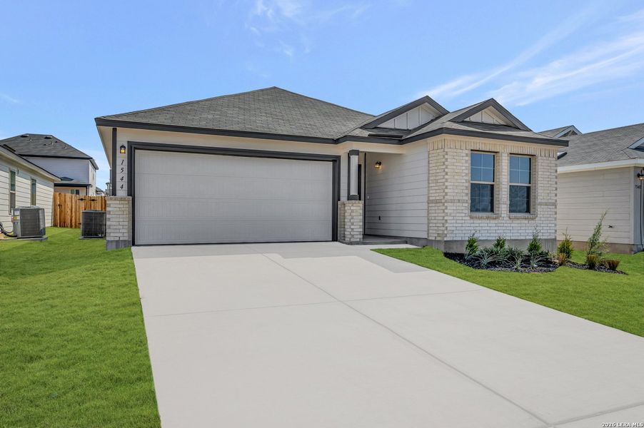 Front exterior of a new home in Meadows at Clear Springs, New Braunfels, TX, highlighting curb appeal (Image 26). Front exterior of a new home in Meadows at Clear Springs, New Braunfels, TX, highlighting curb appeal (Image 26).