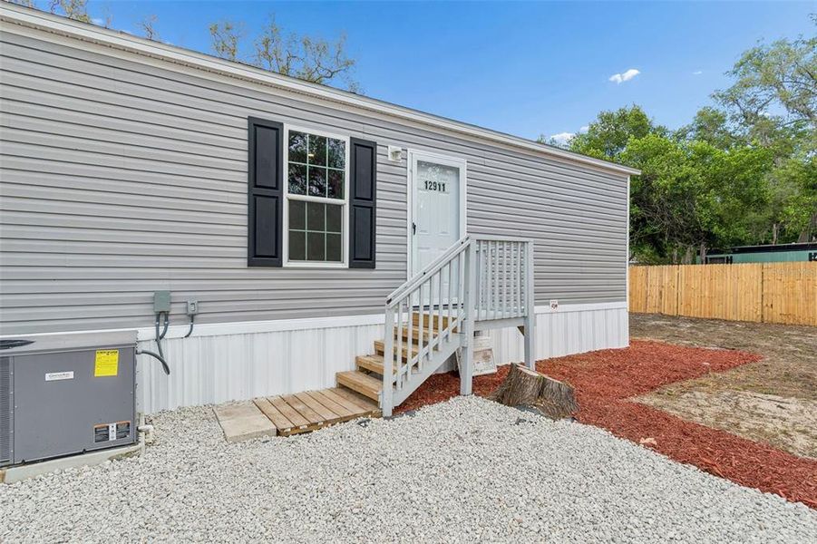 Exterior details and patio area of a home in , New Port Richey (Image 25).
