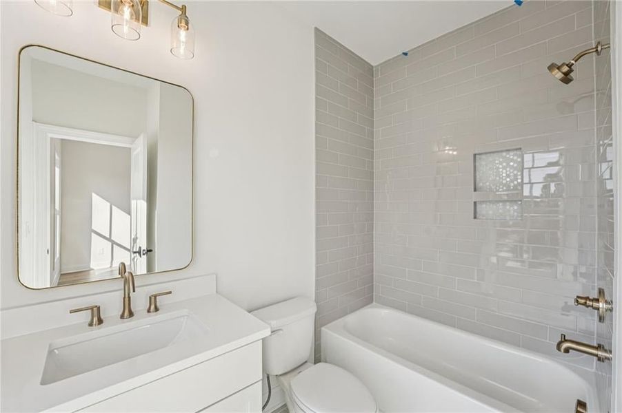 Bathroom featuring vanity and bathing tub / shower combination