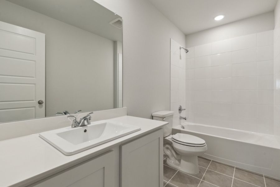 Bathroom in the Hayden home plan by Trophy Signature Homes – REPRESENTATIVE PHOTO