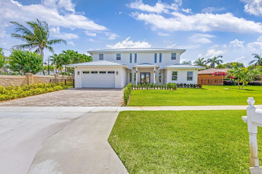 Front exterior of a new home in , North Palm Beach, FL, highlighting curb appeal (Image 25). Front exterior of a new home in , North Palm Beach, FL, highlighting curb appeal (Image 25).