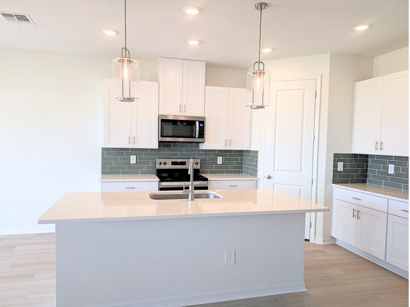 Furnished interior view inside a new home in Coasterra - Reserve Series, Palmetto (Image 4).