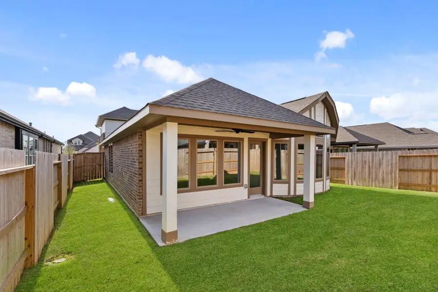 Exterior details and patio area of a home in Grand Central Park, Conroe (Image 3).