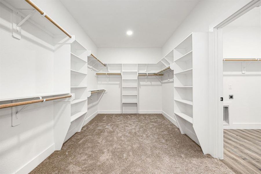 Spacious Walk-In ClosetThis expansive walk-in closet offers ample storage with built-in shelving, hanging rods, and a thoughtfully designed layout. Perfect for organizing your wardrobe with ease while maintaining a clean and stylish look!