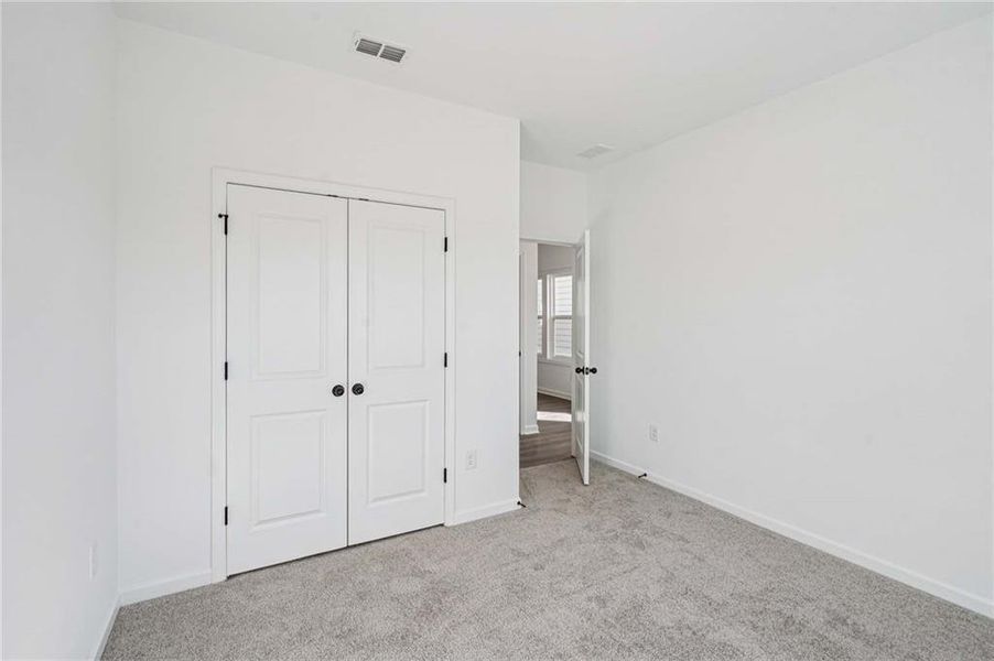 Spacious, unfurnished interior of a new home in Eastlyn Crossing - Single Family, Flowery Branch (Image 23). Spacious, unfurnished interior of a new home in Eastlyn Crossing - Single Family, Flowery Branch (Image 23).