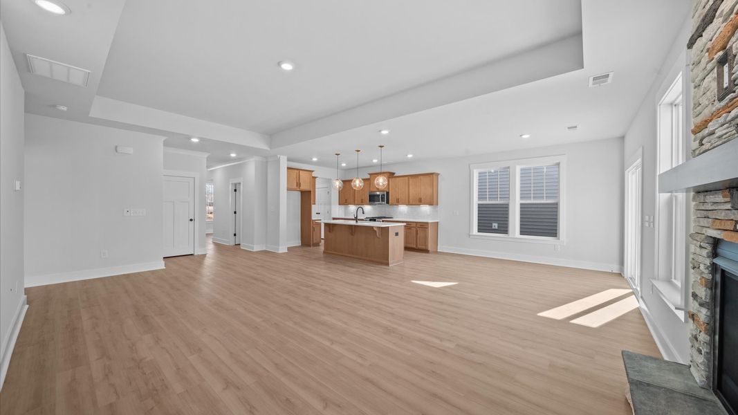 Memorable moments begin in this elegant, open family room with hardwood flooring and refined finishes