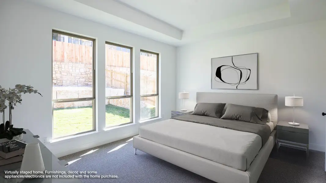 Carpeted bedroom with a raised ceiling Carpeted bedroom with a raised ceiling