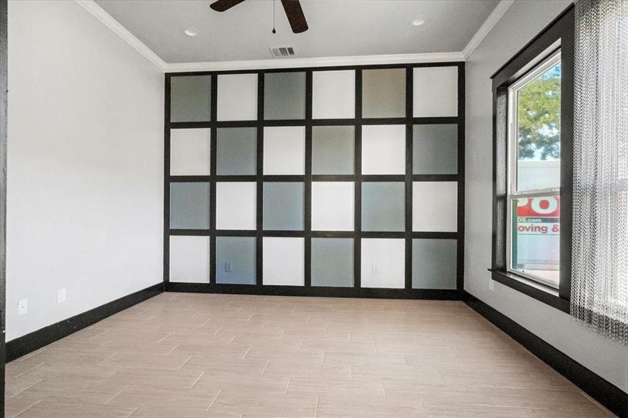 Empty room with crown molding, wood finish floors, ceiling fan, and recessed lighting