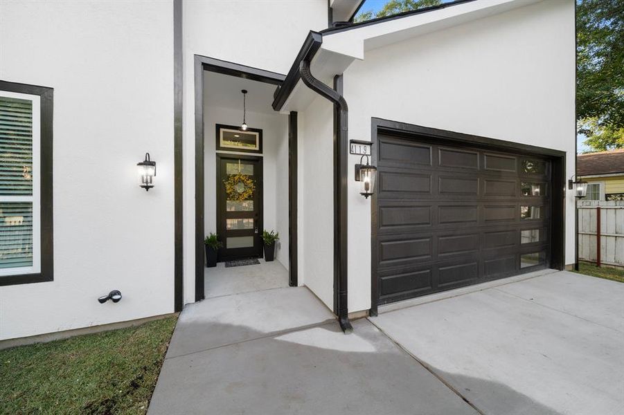 Entrance to property featuring a garage