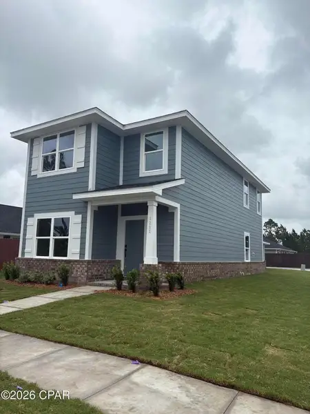 Front exterior of a new home in East Bay, Panama City, FL, highlighting curb appeal (Image 2). Front exterior of a new home in East Bay, Panama City, FL, highlighting curb appeal (Image 2).