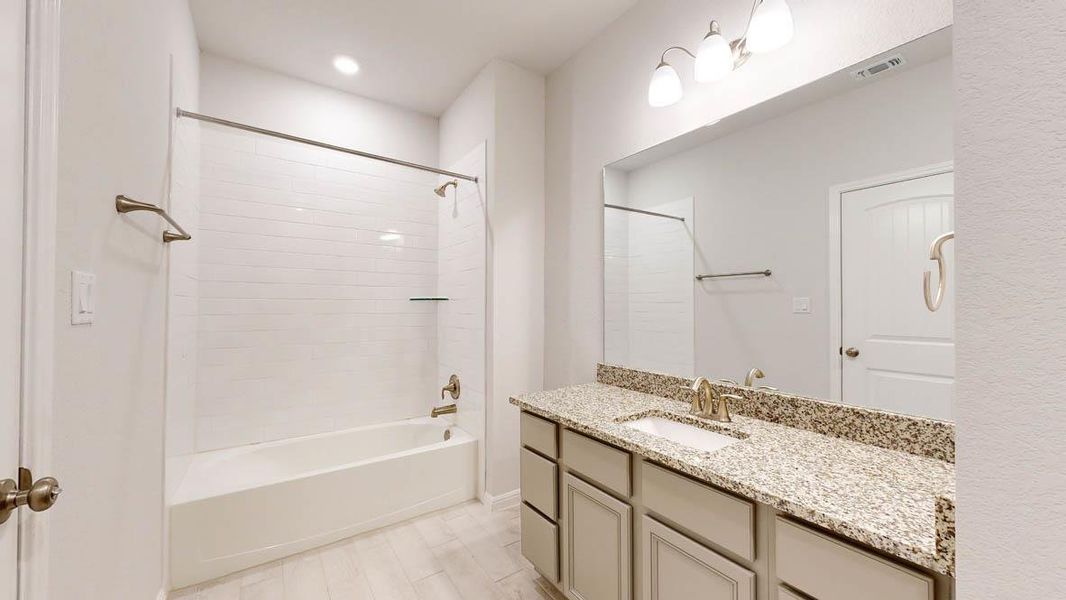 Full bathroom with shower / bathtub combination, vanity, and recessed lighting