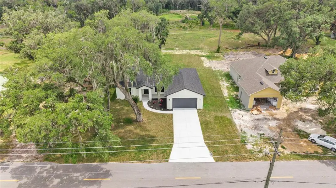 Front exterior of a new home in , Bartow, FL, highlighting curb appeal (Image 26). Front exterior of a new home in , Bartow, FL, highlighting curb appeal (Image 26).