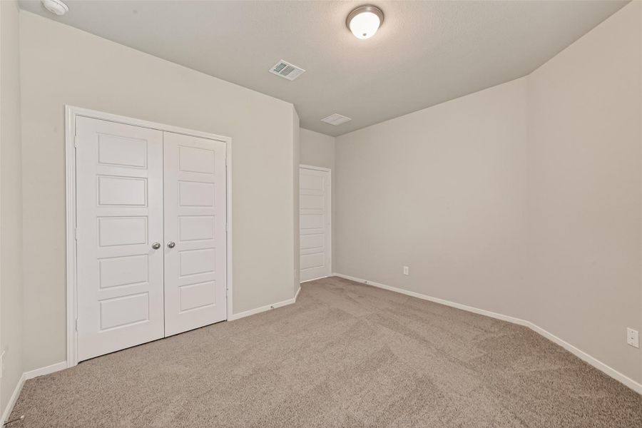 Spacious, unfurnished interior of a new home in Sunterra, Katy (Image 36).