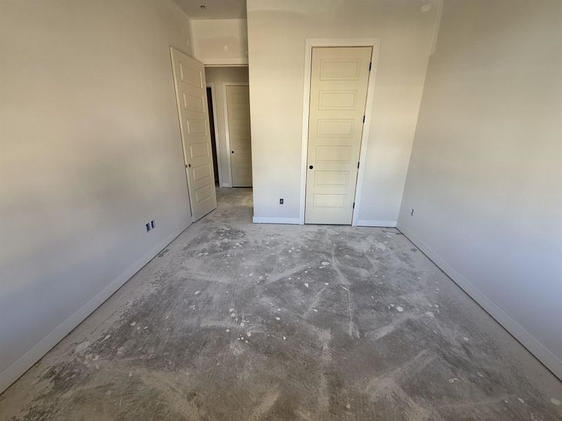 Unfurnished bedroom featuring baseboards and a closet