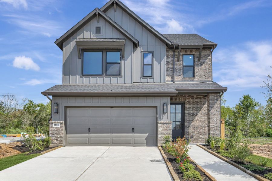 Front exterior of a new home in Sienna - Grove Collection, Missouri City, TX, highlighting curb appeal (Image 29).