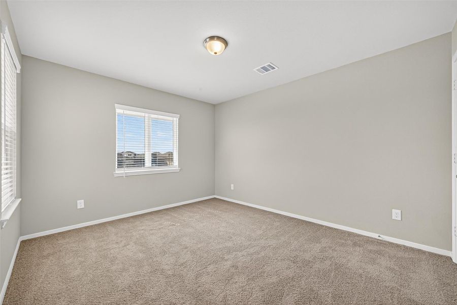 Spacious, unfurnished interior of a new home in Sunterra, Katy (Image 41).