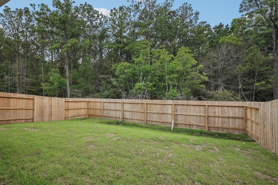 Front exterior of a new home in , New Caney, TX, highlighting curb appeal (Image 2).