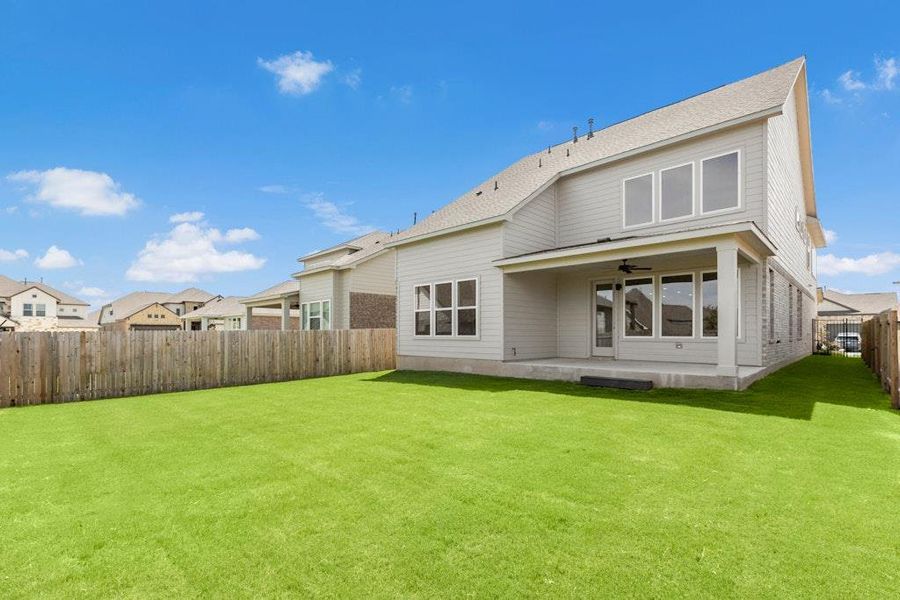 Front exterior of a new home in Santa Rita Ranch, Liberty Hill, TX, highlighting curb appeal (Image 1). Front exterior of a new home in Santa Rita Ranch, Liberty Hill, TX, highlighting curb appeal (Image 1).