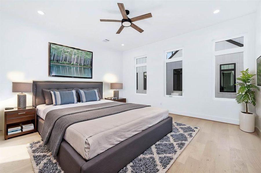 Large master bedroom with lots of natural lighting. This is virtually staged