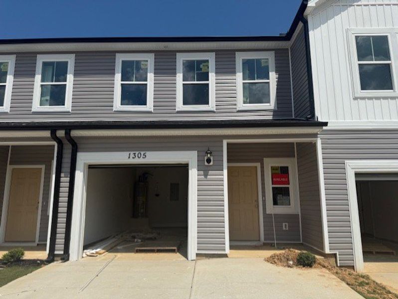 Front exterior of a new home in Caroleton Townhomes, Grovetown, GA, highlighting curb appeal (Image 18). Front exterior of a new home in Caroleton Townhomes, Grovetown, GA, highlighting curb appeal (Image 18).