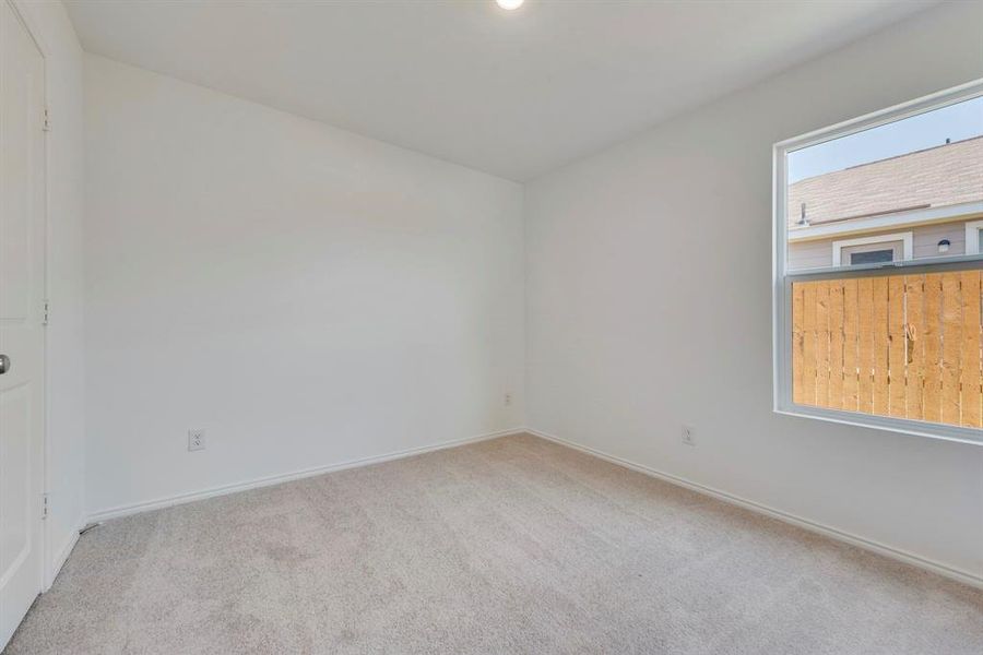 Unfurnished room featuring carpet flooring