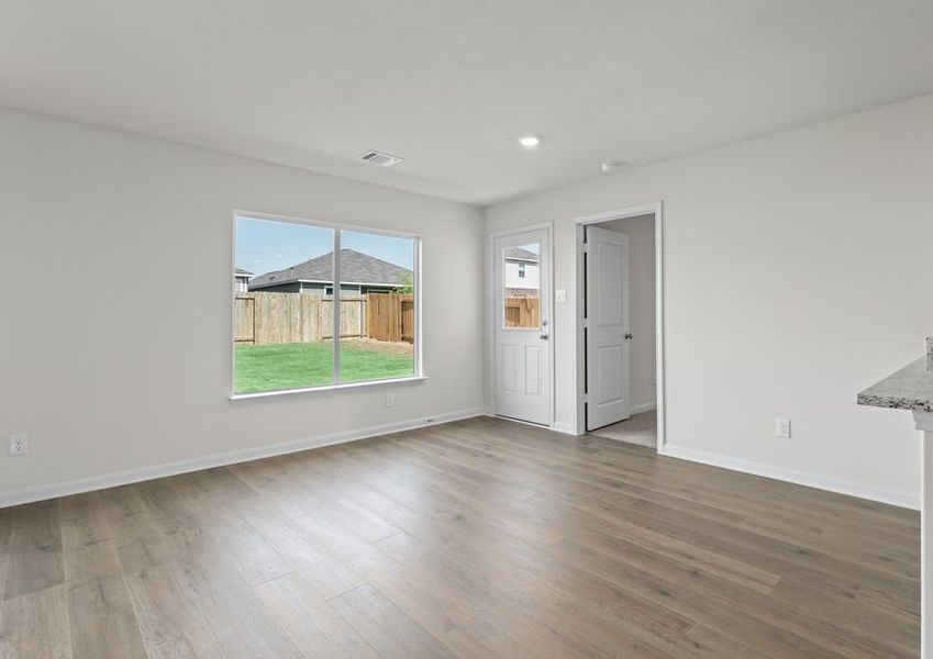 The dining room sits right off of the kitchen and has a large window.