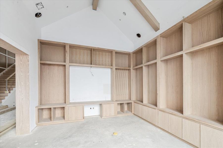 Another view of the library - open to the foyer and front staircase.  Vaulted beamed ceilings for a dramatic presence.